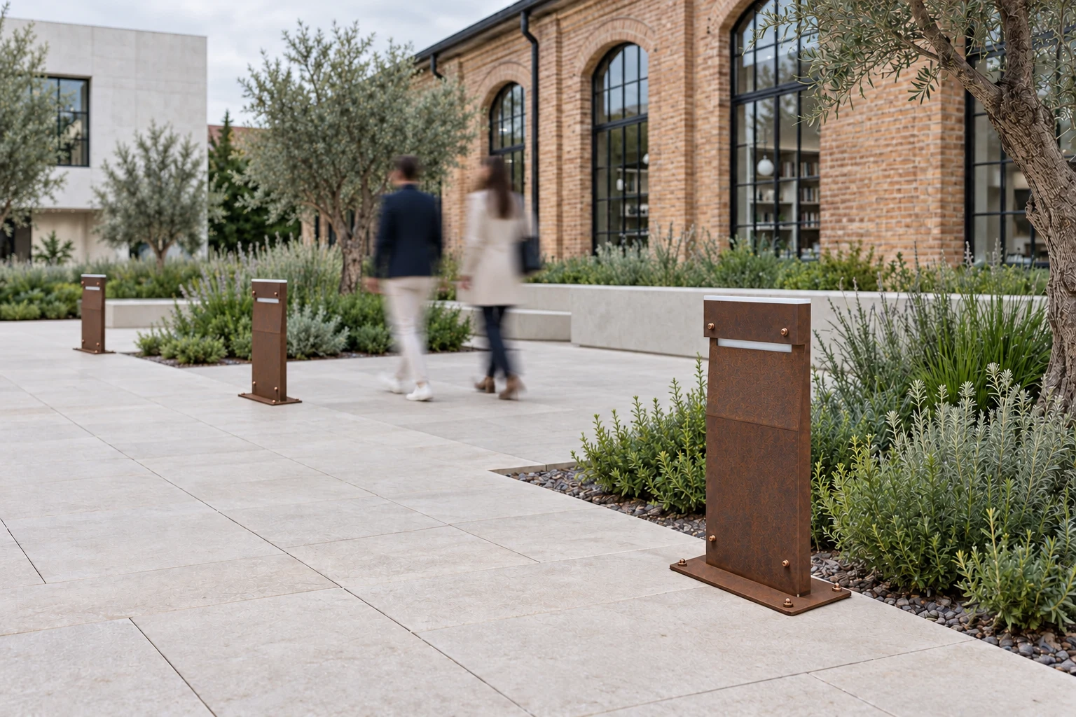 Daytime concept of the same square with switched-off DOLMEN base bollards in a proposed corten finish